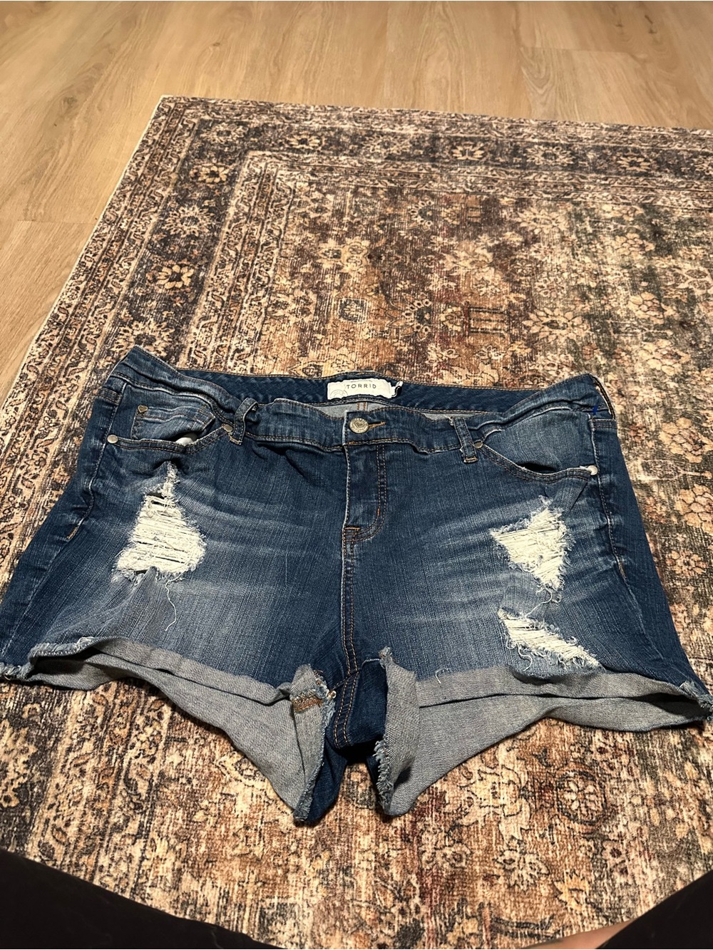 torrid medium blue distressed rolled-hem jean shorts